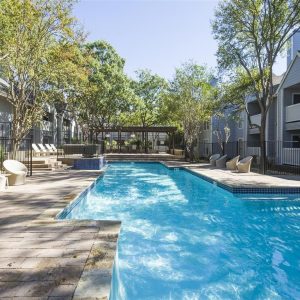 Oddly Shaped Pool Between Apartment Homes