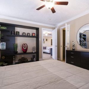 Bedroom with Doors to Living Room and Bathroom