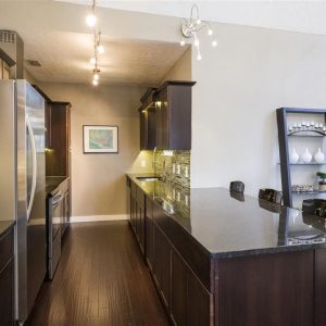Black Granite Kitchen Top with Dark Oak Cabinets