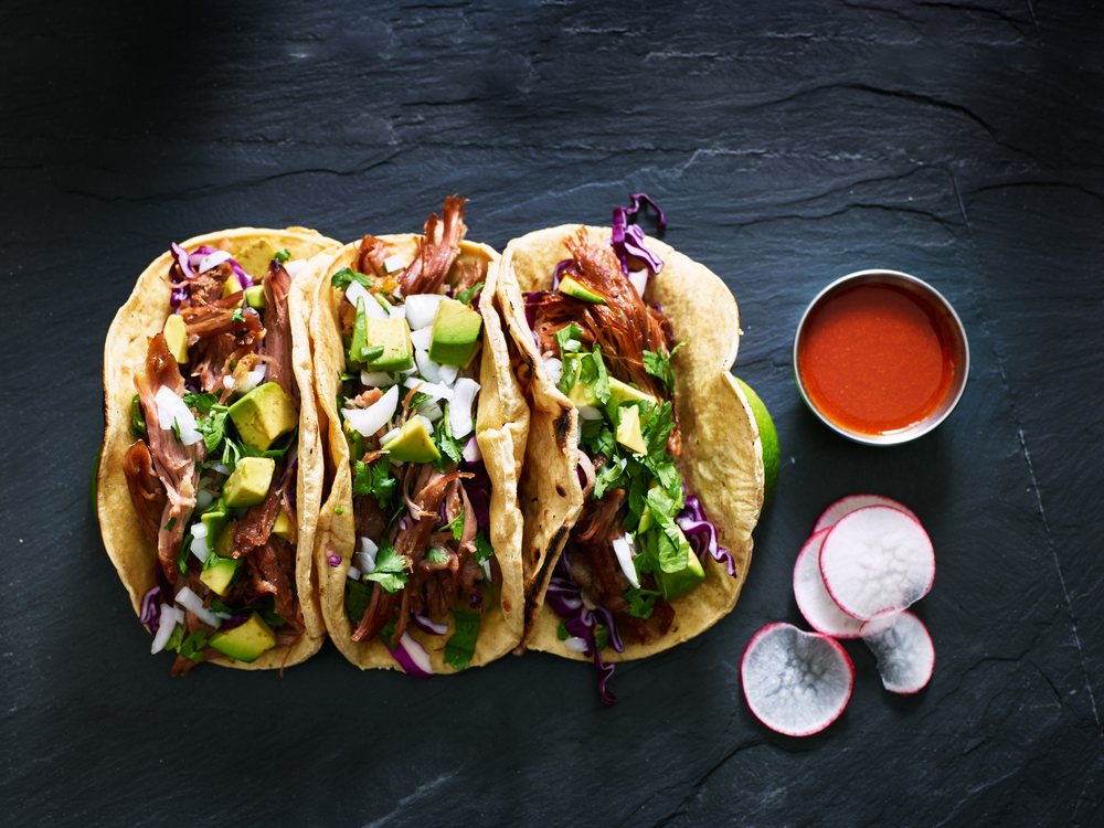 tacos with sauce and garnish