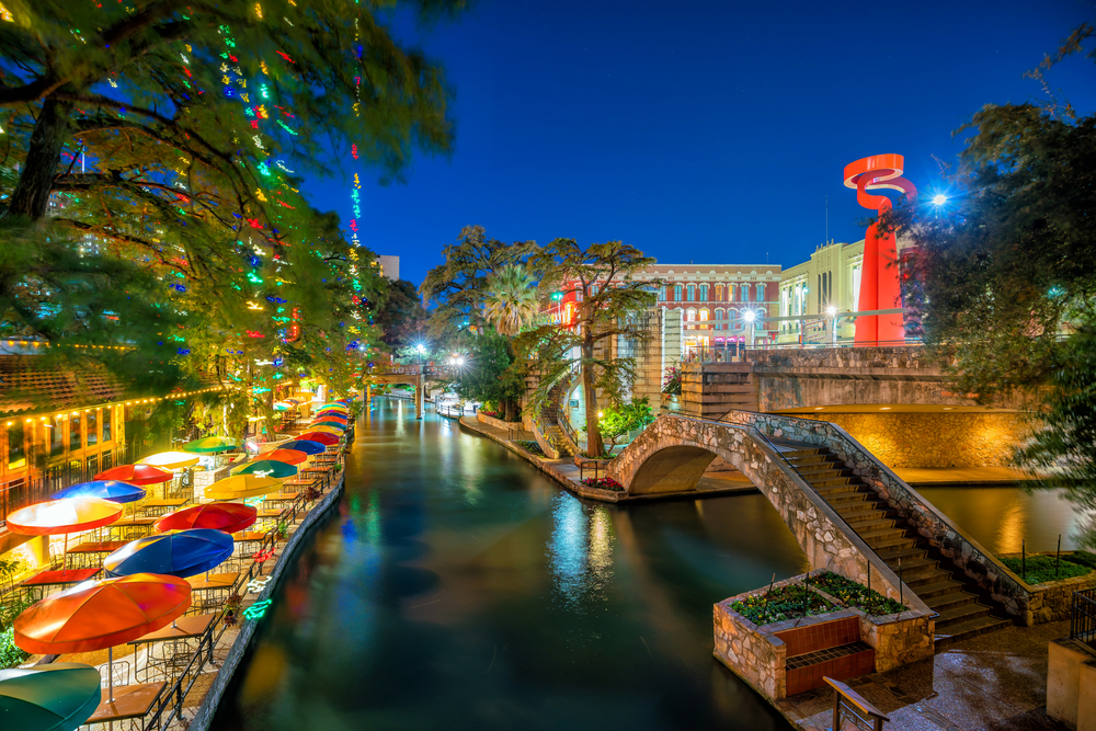 San Antonio riverwalk at night featuring dining, bars, nighlife, shops, and more.